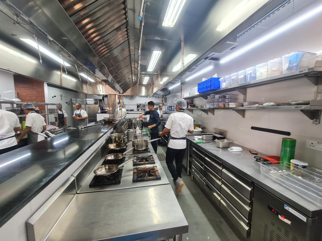 Restaurant kitchen with stainless-steel line